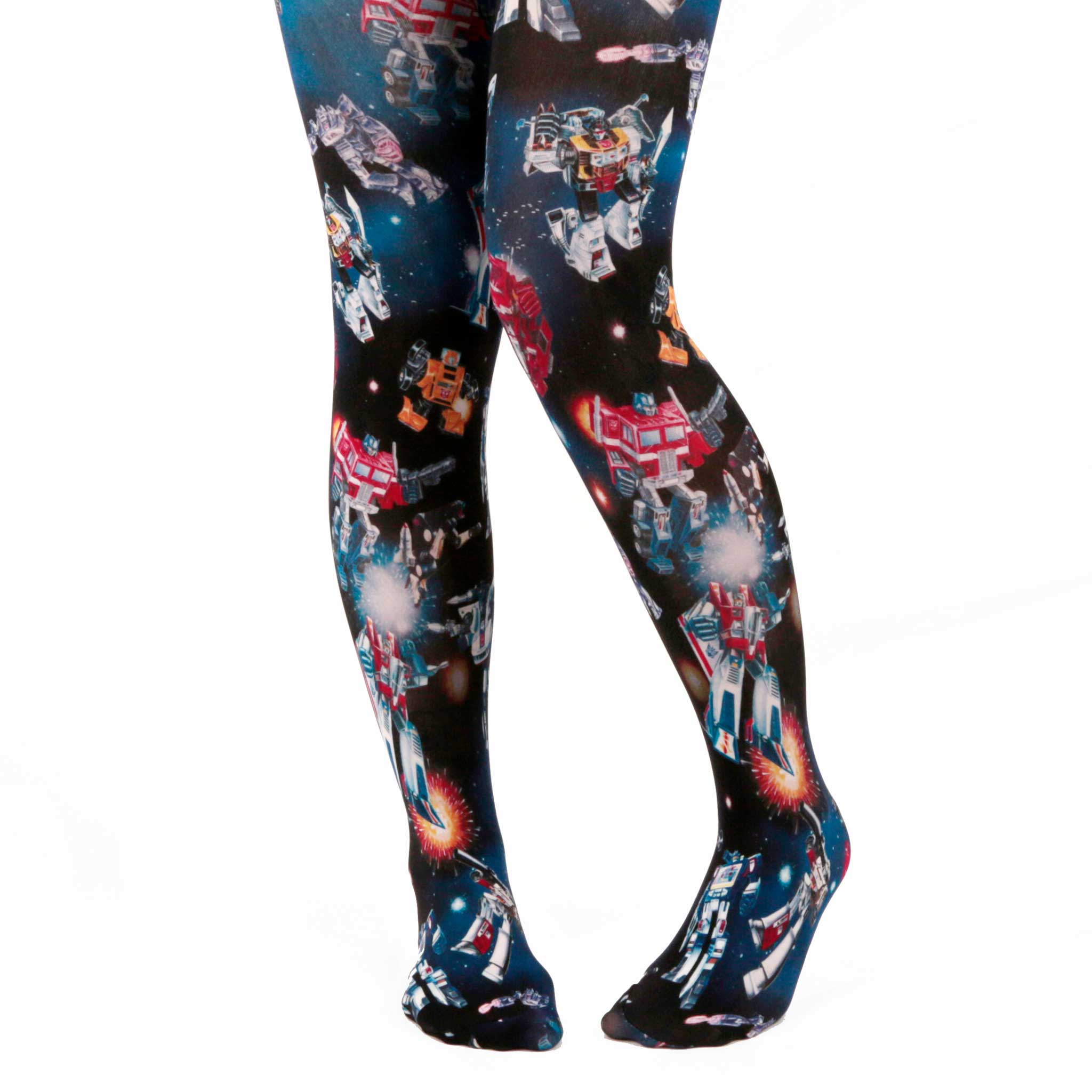 A pair of Transformers inspired tights featuring a black and blue print of Autobots and Decepticons floating in outer space, locked in battle. While yellow, red and white explosions are scattered over the midnight sky.