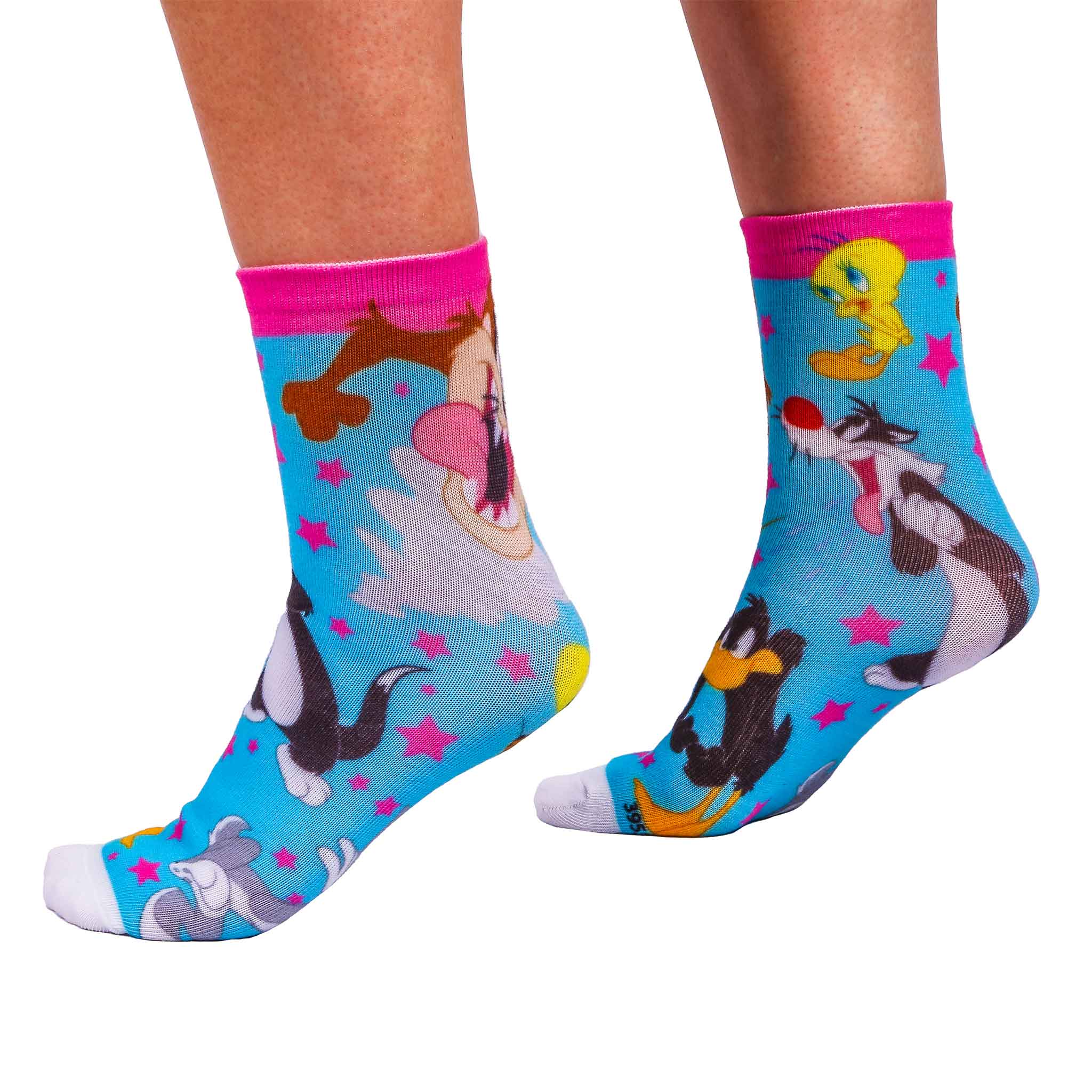 Bright blue socks with Looney Tunes characters Tweety Bird, Taz of Tasmania, Sylvester the Cat, Daffy Duck, and Bugs Bunny who are surrounded with pink stars and matching ankle band.